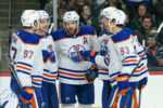 Oilers teammates celebrate goal