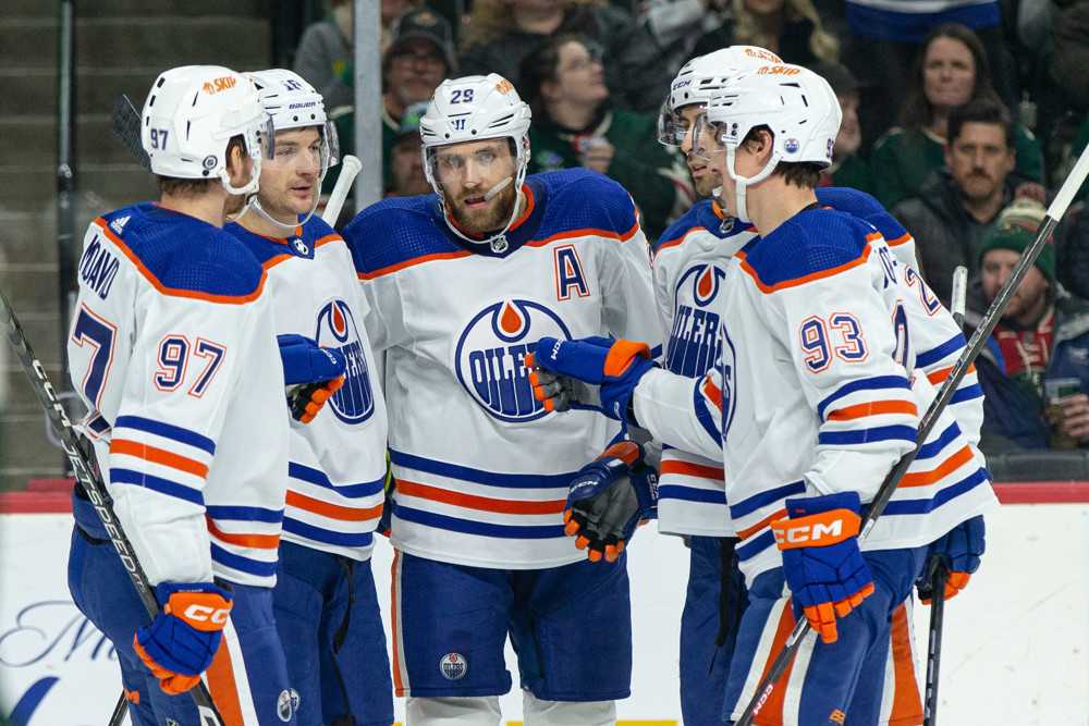 Oilers teammates celebrate goal