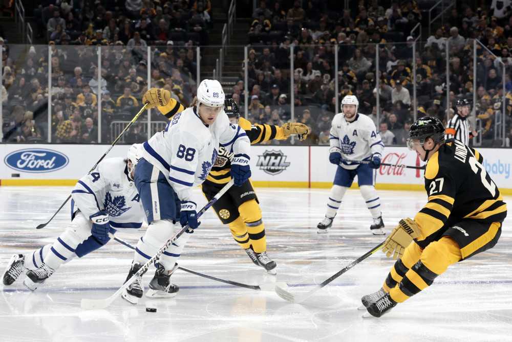 Toronto Maple Leafs winger William Nylander 88 watched by Boston Bruins defenseman Hampus Lindholm 27