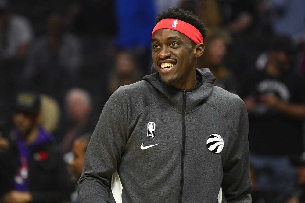 Pascal Siakam is a top-10 NBA player right now 43 Pascal Siakam smiles during warmup wearing a red headband and a grey zip-up hoodie with the Raptors logo on the left breast.