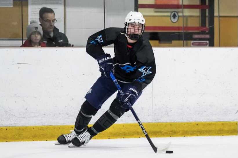 Schaefer skates with the puck