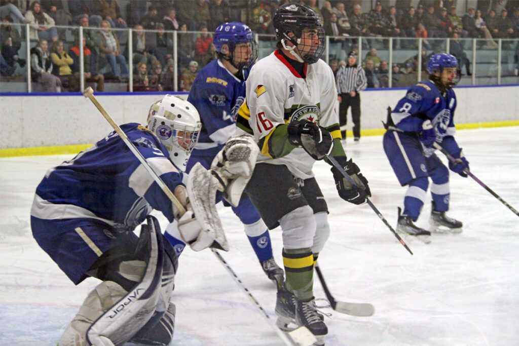 Cubs host Voodoos on Cubs Cushy Giveaway Night 43 Cubs goaltender Noah Metivier (04-G) wearing his blue jersey stands his ground against Powassan Voodoos forward Zach Turner (03-F) wearing his white jersey on January 6.