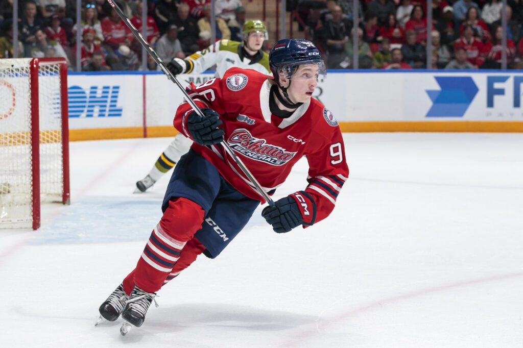 Oshawa Generals Owen Griffin skating in a red jersey