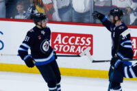 Winnipeg Jets' forwards Cole Perfetti and Kyle Connor celebrate a goal