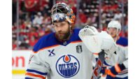 Oilers goalie Stuart Skinner skates away from the bench