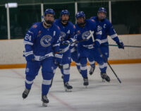 2025 NOJHL Showcase - Greater Sudbury Cubs players - skate toward the bench after scoring a goal. #24 Nolan Newton leads the way. (Caleigh Fera, Points North Media)